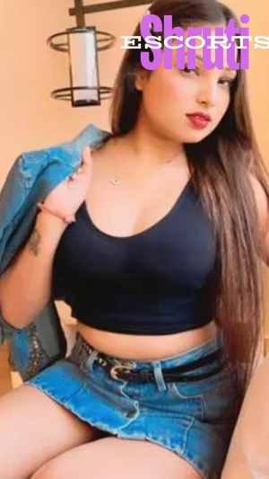 Elite Vasant Kunj escort models posing near a luxury sports car in South Delhi